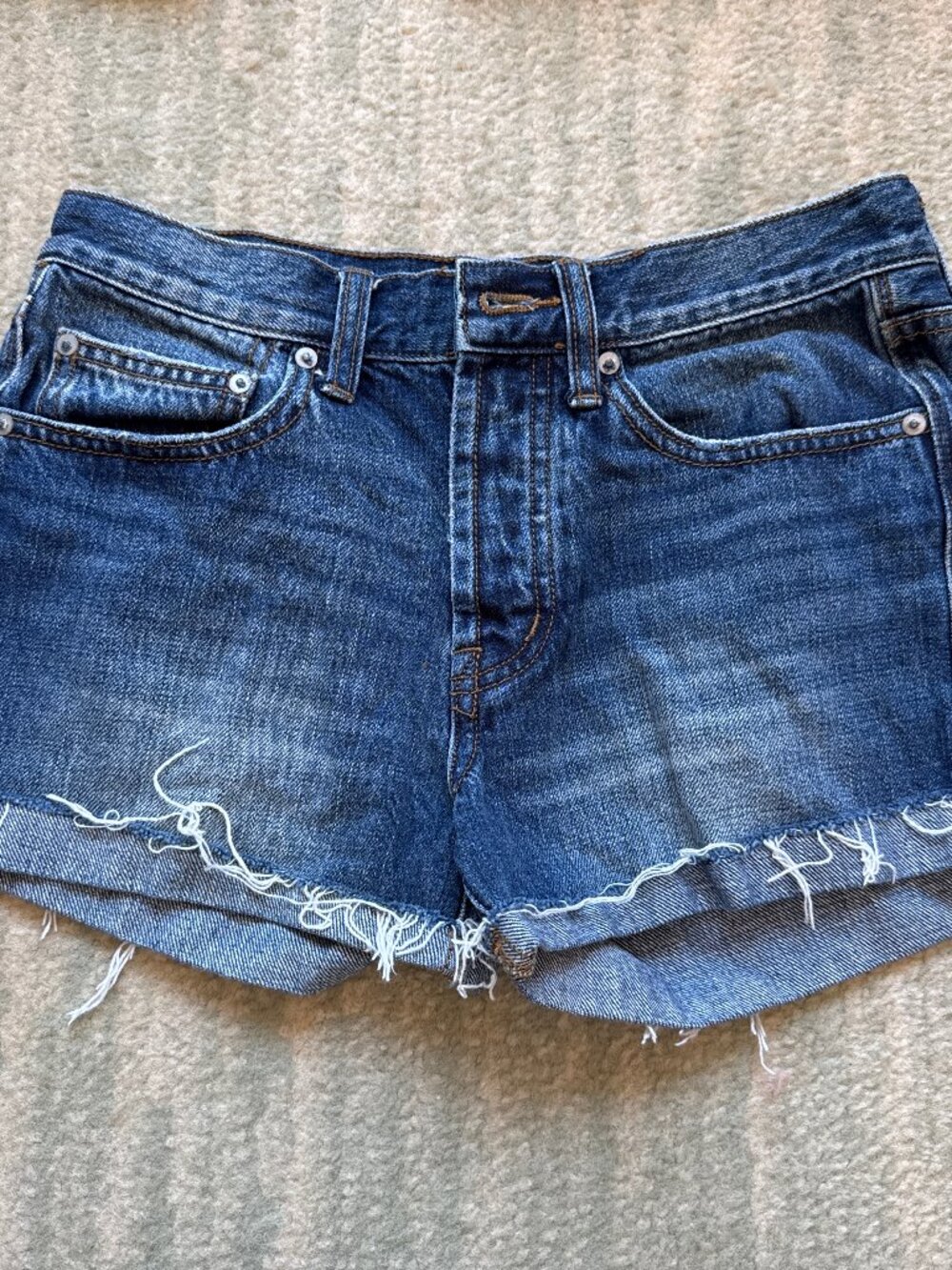 Y2K low rise denim shorts with frayed hem